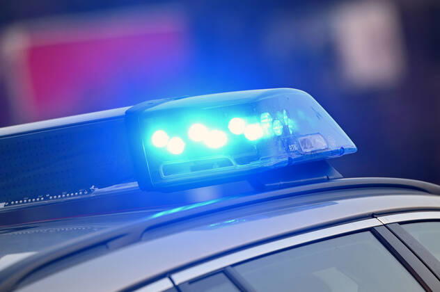 Border controls at the Austrian-German border ,Border crossing Kiefersfelden Border police officers control motorists entering Germany from Tyrol Austria to Bavaria Germany Blue light flashes on an emergency vehicle