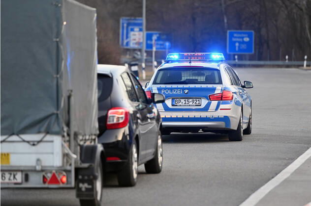Border controls at the Austrian-German border ,border crossing Kiefersfelden Border police officers control motorists entering Bavaria from Tyrol Austria to Bavaria Germany A police car,patrol car guides rejected entrants to the next highway exit Entry refused,rejected,