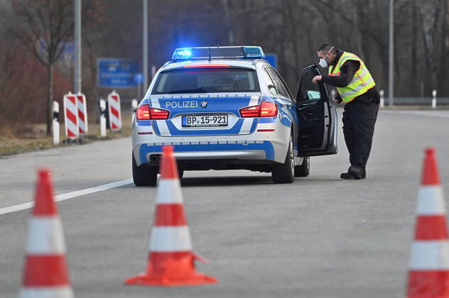 Border controls at the Austrian-German border ,border crossing Kiefersfelden Border police officers control motorists entering Bavaria from Tyrol Austria to Bavaria Germany A police car,patrol car guides rejected entrants to the next highway exit Entry refused,rejected,