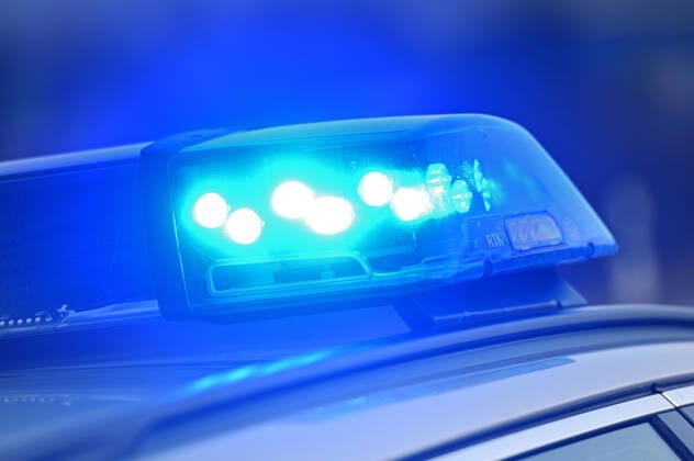 Border controls at the Austrian-German border ,Border crossing Kiefersfelden Border police officers control motorists entering Germany from Tyrol Austria to Bavaria Germany Blue light flashes on an emergency vehicle