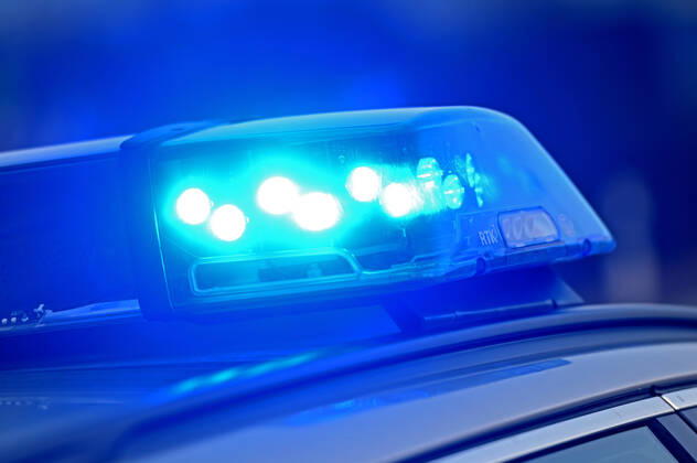 Border controls at the Austrian-German border ,Border crossing Kiefersfelden Border police officers control motorists entering Germany from Tyrol Austria to Bavaria Germany Blue light flashes on an emergency vehicle