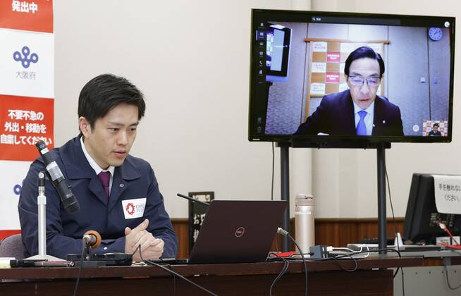 Osaka Gov. Yoshimura Osaka Gov. Hirofumi Yoshimura (L) attends an online conference in Osaka on Feb. 23, 2021, to discuss measures against the novel coronavirus pandemic with governors of neighboring Kyoto and Hyogo prefectures and economic revitalization minister Yasutoshi Nishimura. 