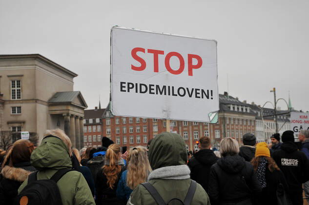 Copenhagen, Denmark. 23 February 2021, Danes proetesting againest coronavirus pandemic new debate in danish parliamenet about quick corona virus pandemic law in danish parliament with all political parties and stage anti pandemic law debates in front of danish parliament and danish police stand peaceful proteact danish parliament in front christiansborg danish parliament in Copenhagen. (Photo..Francis Dean Deanpictures)