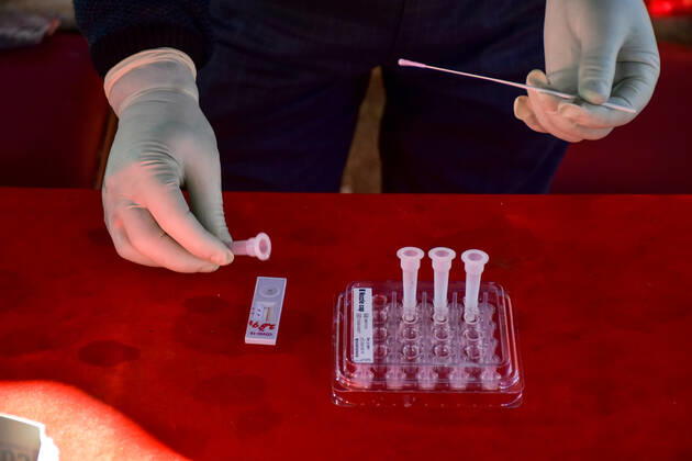 February 23, 2021, Srinagar, India: A health worker holds swab samples collected from local people for antigen rapid test for (COVID-19) Coronavirus at a coronavirus testing center in Srinagar. Jammu and Kashmir recorded 58 new COVID-19 cases which took the infection tally to 1,25,925, officials said. A senior doctor has warned of a second wave of COVID 19 infections, the warning has come at a time when Kashmir valley is witnessing a sharp decrease in daily cases..Jammu and Kashmir recorded 58 new COVID-19 cases which took the infection tally to 125,925, officials said. A senior doctor has warned of a second wave of COVID 19 infections, the warning has come at a time when Kashmir valley is witnessing a sharp decrease in daily cases. Srinag - ZUMAs197 20210223_zaa_s197_026 Copyright: xSaqibxMajeedx