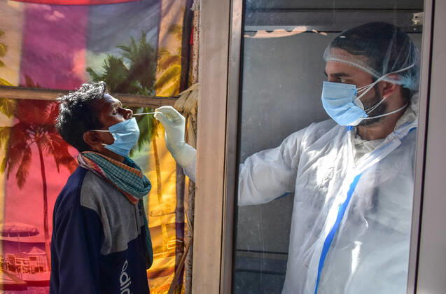 February 23, 2021, Srinagar, India: A health worker takes a nasal swab of a man for a Covid-19 test at a coronavirus testing center in Srinagar..Jammu and Kashmir recorded 58 new COVID-19 cases which took the infection tally to 125,925, officials said. A senior doctor has warned of a second wave of COVID 19 infections, the warning has come at a time when Kashmir valley is witnessing a sharp decrease in daily cases. Srinagar India - ZUMAs197 20210223_zaa_s197_028 Copyright: xSaqibxMajeedx