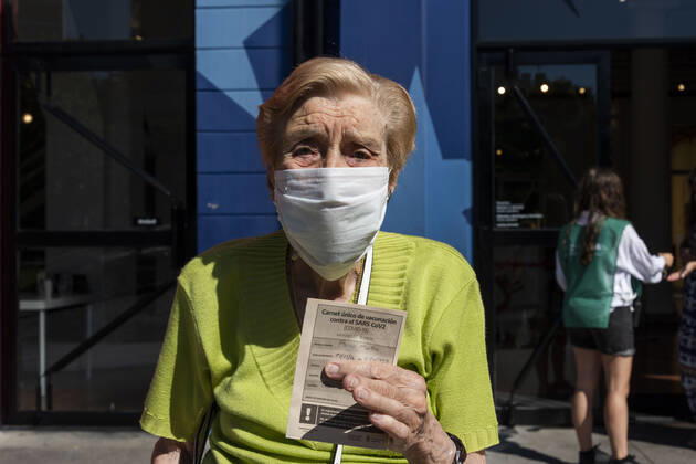 February 23, 2021, City of Buenos Aires, City of Buenos Aires, Argentina: INT. WorldNews. COVID-19. February 23, 2021. City of Buenos Aires, Argentina.- Martha Pairo, 94 years old, shows her vaccine certificate for SARS CoV2 (COVID-19) on Feb 23, 2021, outside a temporary Vaccination Center at Centro Cultural Recoleta, City of Buenos Aires, Argentina..Adults over 80 years old are being vaccinated for SARS CoV2 (COVID-19) since Feb 22, 2021 in City of Buenos Aires, Argentina. City of Buenos Aires Argentina - ZUMAf135 20210223_zap_f135_001 Copyright: xJulietaxFerrariox