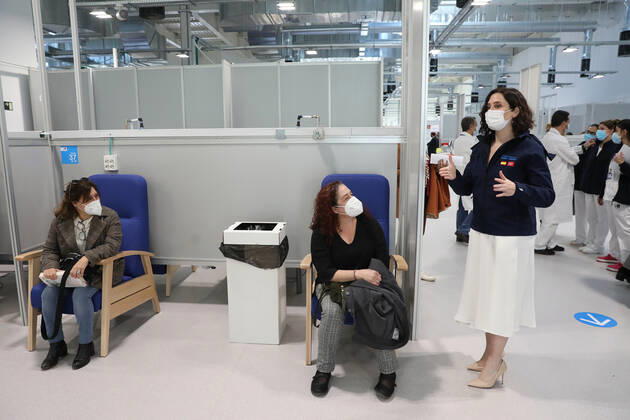 The President of the Community of Madrid, Isabel Diaz Ayuso (r), talks with two patients during her visit to the start of the vaccination process against COVID-19 that has been launched in Pavilion 3 of the Public Hospital Enfermera Isabel Zendal, in Madrid, (Spain), on February 23, 2021. This Tuesday begins the vaccination in the pavilion 3 of the hospital with the vaccine of AstraZeneca to 400 people of External Health, AENA, inspectors of Public Health, of Institute of Social Security, professionals of reformatories, Forensic Doctors, Students of CC Health and veterinarians. These new groups to be vaccinated will be joined by those over 80 years of age on Thursday 25 February in the Primary Care centres of each of the health areas of th Copyright: xLagenciaEPxPRESS M.FERNÃNDEZ.xPOOLx 3576560