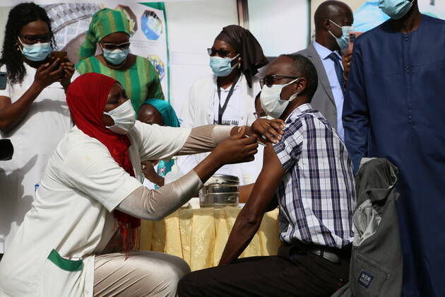 (210224) -- DAKAR, Feb. 24, 2021 -- Senegalese epidemiologist Moussa Seydi receives a dose of COVID-19 vaccine provided by Chinese firm Sinopharm in Dakar, Senegal on Feb. 23, 2021. Senegal on Tuesday officially began the first phase of COVID-19 vaccination, taking a new step in the crusade against the pandemic. Senegalese Minister of Health and Social Action Abdoulaye Diouf Sarr received the first dose of COVID-19 vaccine in front of the press at his ministry, which symbolized the starting point of Senegal s vaccination campaign. ) SENEGAL-CHINA-COVID-19-VACCINE-INOCULATION XingxJianqiao 