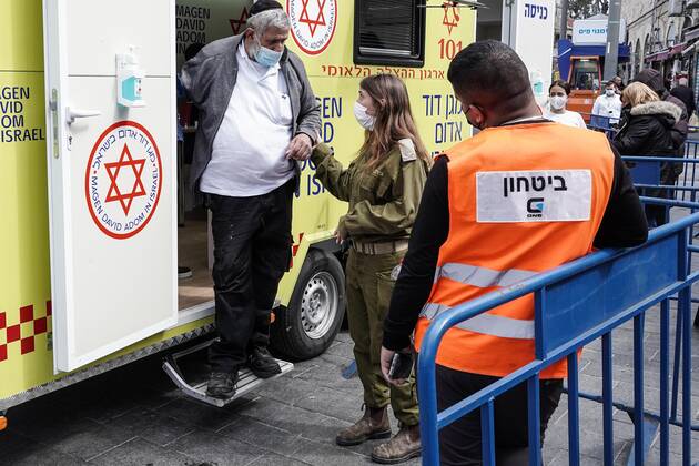 February 24, 2021, Jerusalem, Israel: The IDF Home Front Command in coordination with Magen David Adom, serving as the Israeli Red Cross organization and leading EMS, make COVID-19 vaccinating more accessible to those still in denial or refusal operating a mobile vaccination station out of a caravan at JerusalemÃ¢â‚¬â ¢s Shuk Mahane Yehuda Market. Jerusalem Israel - ZUMAa126 20210224_zap_a126_015 Copyright: xNirxAlonx
