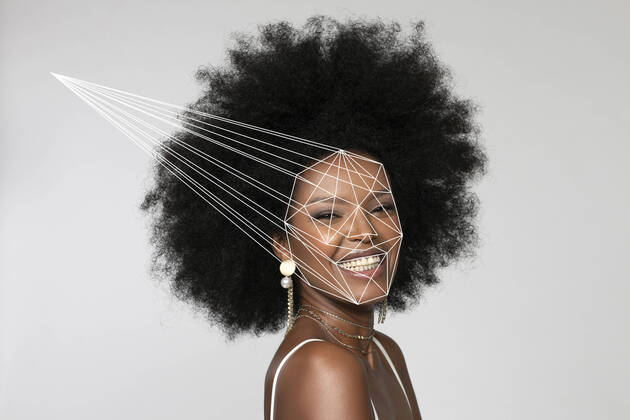 Smiling Afro woman with facial recognition laser beam against white background model released Symbolfoto EIF00370