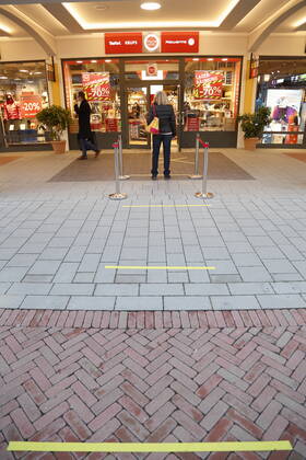 Corona situation in Outlet Center Parndorf, 23 02 2021 Corona pandemic, Corona, Corona virus, CoV 2, Covid 19, Sars, virus, virus infection, pandemic, Corona crisis, viral disease, Coronavirus, SARS CoV 2 Reopened trade shop, shops, open, open queues keep distance Vienna Austria AVN10100245469