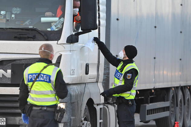 Border controls at the Austrian-German border ,border crossing Kiefersfelden border police officers control trucks, goods carriers, supply chain at the entry from Tyrol Austria to Bavaria Germany