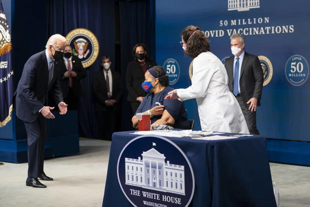February 25, 2021, Washington, District of Columbia, USA: Before getting her Covid Vaccine, President Joe Biden talks with Linda Bussey, who has worked at Safeway for 37 years and currently serves a general merchandise manager in Bethesda, MD. Ms. Bussey lives in Southeast DC. Ms. Bussey has been working ever since the pandemic. as he participates in an event commemorating the 50 million COVID-19 vaccine shot during a ceremony at the White House, Thursday, Feb. 25, 2021. Ms. Bussey lives in Southeast DC. Ms. Bussey has been working ever since the pandemic Washington USA - ZUMAs152 20210225_zaa_s152_214 Copyright: xDougxMillsx