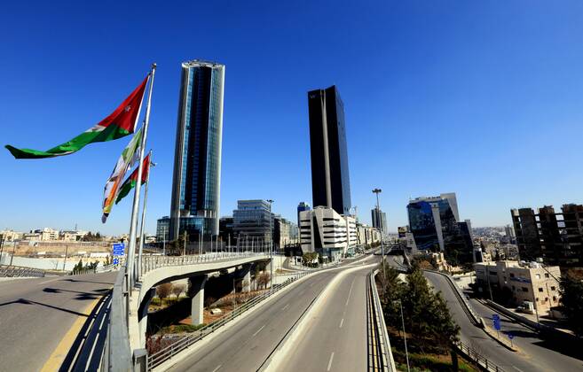 (210227) -- AMMAN, Feb. 27, 2021 -- Photo taken on Feb. 26, 2021 shows empty streets in Amman, Jordan. Jordan on Wednesday decided to reinstate curfew on each Friday starting from Feb. 26 in addition to extending daily curfew by two hours as part of anti-pandemic measures as infections keep rising in the kingdom. During a press conference on Wednesday, Minister of State for Media Affairs Ali Al Ayed announced that businesses are allowed to operate until 9 p.m. local time while public movement will be permitted from 6 a.m. until 10 p.m. as of Thursday. (Photo by Xinhua) JORDAN-AMMAN-COVID-19-CURFEW MohammadxAbuxGhosh 