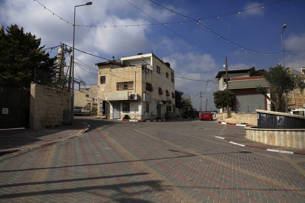 February 28, 2021, Jenin, West Bank, Palestinian Territory: A deserted street is pictured during a complete closure, amid the coronavirus lockdown in the town of Zababdeh, south of Jenin, in the West Bank on February 28, 2021. Prime Minister Mohammad Shtayyeh announced a new set of restrictions in response to a recent surge in coronavirus infections, including of British and South African mutants, in Palestine.A lockdown of all public and private schools for all classes, except for high school students for a period of 12 days, including kindergartens..A lockdown of all universities, educational and vocational institutes and shifting to distance e-learning programs. A maximum of 50 percent of administrative staff are allowed access to univer - ZUMAap3_ 20210228_zaf_ap3_040 Copyright: xOdayxDaibesx