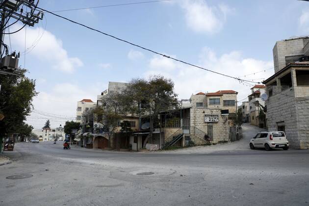 February 28, 2021, Jenin, West Bank, Palestinian Territory: A deserted street is pictured during a complete closure, amid the coronavirus lockdown in the town of Zababdeh, south of Jenin, in the West Bank on February 28, 2021. Prime Minister Mohammad Shtayyeh announced a new set of restrictions in response to a recent surge in coronavirus infections, including of British and South African mutants, in Palestine.A lockdown of all public and private schools for all classes, except for high school students for a period of 12 days, including kindergartens..A lockdown of all universities, educational and vocational institutes and shifting to distance e-learning programs. A maximum of 50 percent of administrative staff are allowed access to univer - ZUMAap3_ 20210228_zaf_ap3_041 Copyright: xOdayxDaibesx