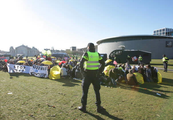 Dutch anti-riot police enclose anti-lockdown supporters during illegal demonstration against the coronavirus measures at the Museumplein on February 28, 2021 in Amsterdam,Netherlands. Amsterdam Mayor Femke Halsema classified the Museumplein as security risk area , giving police officers the right to check and search anybody in that area to prevent illegal demonstration and vandalism. Amsterdam Netherlands Copyright: xPauloxAmorimx amp20210228_013