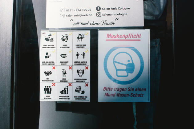(210301) -- COLOGNE, March 1, 2021 -- Signs introducing the COVID-19 prevention measures are seen at the entrance of a hair salon amid COVID-19 pandemic in Cologne, Germany, March 1, 2021. Hair salons in Germany reopened on Monday with COVID-19 prevention measures. (Photo by Xinhua) GERMANY-COLOGNE-COVID-19-HAIR SALON-REOPENING TangxYing 