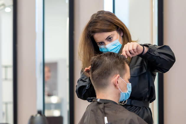 01 03 2021,Berlin,Germany,GER,with today the hairdressers nationwide are allowed to go back to their work Picture was taken in the premises of Chamun Coiffeur and Beauty Kurfürstendamm