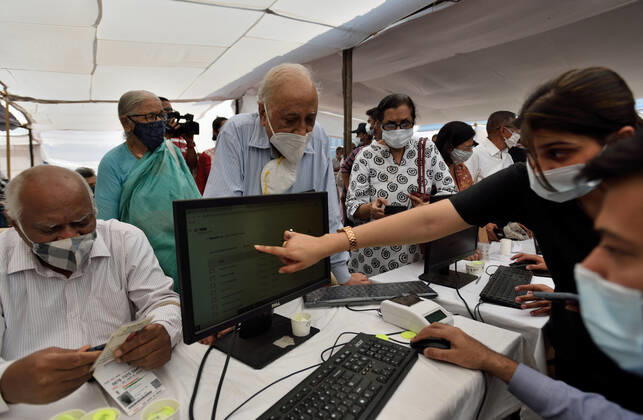 MUMBAI, INDIA - MARCH 1: Senior citizen registering to get their first dose of a Covid-19 vaccination, at BKC on March 1, 2021 in Mumbai, India. India?s Covid-19 vaccination drive was extended today to include the elderly and those with co-morbidities. (Photo by Satish Bate Hindustan Times) Covid Vaccination Phase 2 Starts In India