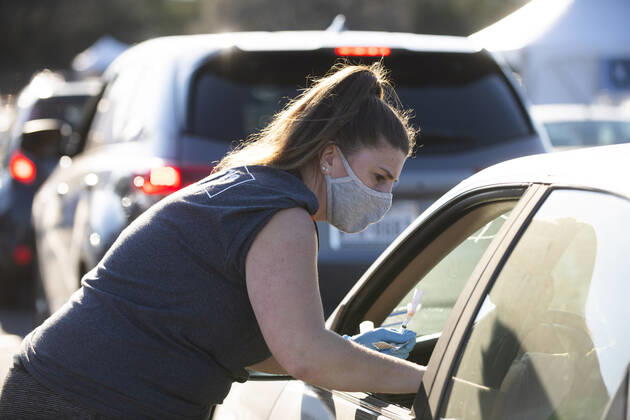 March 7, 2021, Round Rock, Texas, USA: Round Rock, TX USA March 6, 2021: Emergency tech Tabitha Kozster vaccinates a patient as Williamson County hosts a 24-hour vaccine marathon to catch up with COVID-19 vaccination schedule after last month s devastating winter storm that crippled much of Texas. The goal was to vaccinate up to 7,000 Texans with first or second Moderna doses. Round Rock USA - ZUMAd150 20210307_znp_d150_007 Copyright: xBobxDaemmrichx