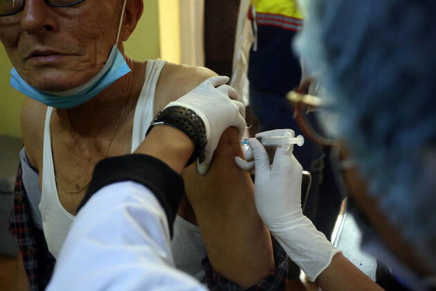March 8, 2021, Kathmandu, Bagmati, Nepal: An elderly man receives a dose of Covishield COVID-19 vaccine at a hospital in Kathmandu,Nepal on March 8, 2021. Nepal started the nationwide campaign to inoculate the elderly population,over 65 years with with Covishield,the Oxford-AstraZeneca vaccine. Kathmandu Nepal - ZUMAs233 20210308_zap_s233_001 Copyright: xSunilxSharmax