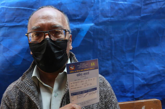 March 8, 2021, Kathmandu, Bagmati, Nepal: An elderly person shows his vaccine card after receiving a dose of Covishield COVID-19 vaccine at a hospital in Kathmandu,Nepal on March 8, 2021. Nepal started the nationwide campaign to inoculate the elderly population,over 65 years with with Covishield,the Oxford-AstraZeneca vaccine. Kathmandu Nepal - ZUMAs233 20210308_zap_s233_003 Copyright: xSunilxSharmax