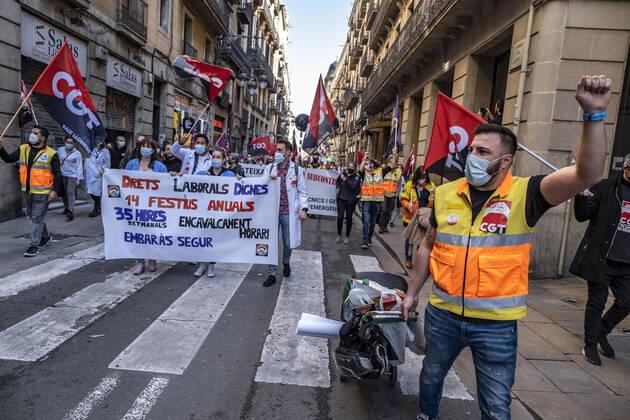March 10, 2021, Barcelona, Catalonia, Spain: Protesters marching with banners and flags entering Plaza Sant Jaume during the demonstration..Under the slogan estemfartes (we are fed up), the Catalan Health Union Board, formed by minority unions, has mobilized health workers to a day of strike to denounce the physical fatigue of health professionals and salary cuts. Barcelona Spain - ZUMAs197 20210310_zaa_s197_155 Copyright: xPacoxFreirex