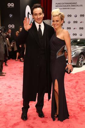 John Cusack and Barbara Sturm at the GQ Men of the Year 2012 award ceremony in Berlin Mens style magazine GQ Gentlemens Quarterly from Conde Nast Verlag presents the award at the Komische Oper in Berlin. Copyright: xEventpressxHerrRax