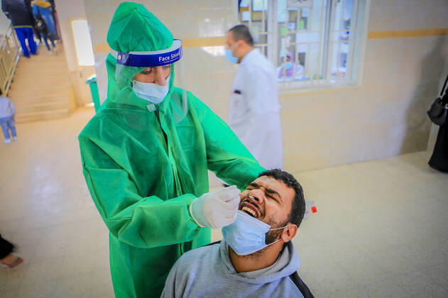 March 17, 2021, Gaza City, The Gaza Strip, Palestine: A shot of the Sputnik V Covid-19 vaccine is prepared to be administered at the Ministry of Health Sabha Al Harazeen clinic, in Al Shejaeiya neighborhood, in the east of Gaza City, 17 March 2021. The Palestinian Authority received on 17 March around 60,000 coronavirus vaccine doses as a first shipment through the COVAX initiative. People start to receive doses of Russia s Sputnik V COVID-19 coronavirus vaccine in the Ministry of Health clinics and United Nations Relief and Works Agency for Palestine Refugees (UNRWA) s clinics. Gaza City Palestine - ZUMAq100 20210317_zaa_q100_007 Copyright: xAbedxAlrahmanxAlkahloutx