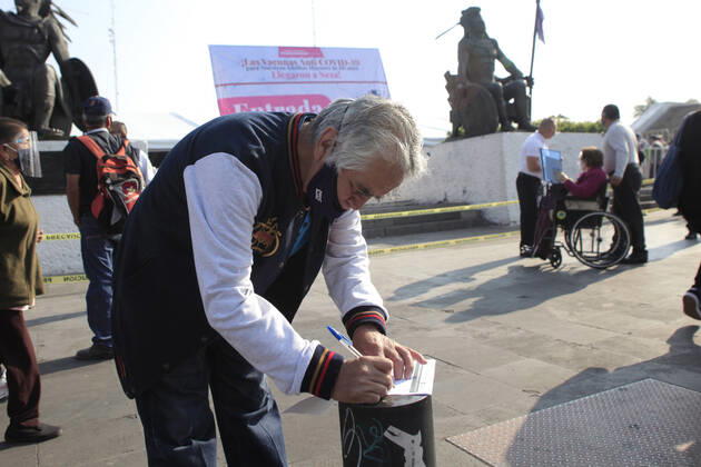 Begins Apply Of Dose Of Sputnik V In Mexico NEZAHUALCOYOTL CITY, MEXICO - MARCH 19: A elderly fill out a form at vaccine center to receive a pass and be able to access the vaccination module, where health workers apply the Sputnik V vaccine, during the mass vaccination of the national vaccination program for adults over 60 years old against Covid-19 disease, at Nezahualcoyotl Sports Unit located in municipality of Nezahualcoyotl, State of Mexico. On March 19, 2021 in Nezahualcoyotl City, Mexico. Copyright: xAngelxMoralesxRizox EYEPIXGROUP_AM_19032021_5020