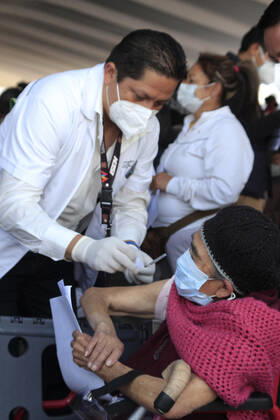 Begins Apply Of Dose Of Sputnik V In Mexico NEZAHUALCOYOTL, MEXICO - MARCH 19: A elderly receives a Sputnik V dose, during the mass vaccination of the national vaccination program for adults over 60 years old against Covid-19 disease, inside Nezahualcoyotl Sports Unit located at municipality of Nezahualcoyotl, state of Mexico. On March 19, 2021 in Nezahualcoyotl City, Mexico. Copyright: xAngelxMoralesxRizox EYEPIXGROUP_AM_19032021_5025