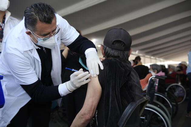 Begins Apply Of Dose Of Sputnik V In Mexico NEZAHUALCOYOTL, MEXICO - MARCH 19: A elderly receives a Sputnik V dose, during the mass vaccination of the national vaccination program for adults over 60 years old against Covid-19 disease, inside Nezahualcoyotl Sports Unit located at municipality of Nezahualcoyotl, state of Mexico. On March 19, 2021 in Nezahualcoyotl City, Mexico. Copyright: xAngelxMoralesxRizox EYEPIXGROUP_AM_19032021_5029
