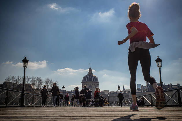 (210320) -- PARIS, March 20, 2021 -- People are seen on the Pont des Arts bridge in Paris, France, on March 20, 2021. French Prime Minister Jean Castex on Thursday announced new massive measures to curb COVID-19 in the country s 16 worst-hit regions, including Paris. Starting Friday midnight, about 18 million French people in regions such as Paris, Hauts-de-France in the north as well as the Alpes-Maritimes on the Mediterranean should stay at home, Castex announced at a press briefing on the epidemic situation. (Photo by Xinhua) FRANCE-PARIS-COVID-19-PARTIAL LOCKDOWN AurelienxMorissard 