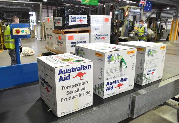 AUSMAT VACCINE PNG COVID19 RESPONSE, Royal Australian Air Force personal are seen preparing COVID-19 vaccines and humanitarian supplies for loading onto a C-17A Globemaster at RAAF Base Amberley, west of Brisbane, Tuesday, March 23, 2021. Australia are sending 8,000 doses of its COVID-19 vaccine supply to Papua New Guinea who have more than 1,400 active cases of COVID-19 and the Australian government are asking AstraZeneca and European authorities to divert another 1 million doses to Papua New Guinea. ( NO ARCHIVING, EDITORIAL USE ONLY, NO USE IN BOOKS WITHOUT CONSENT BRISBANE QLD AUSTRALIA  Copyright: xDARRENxENGLANDx 20210323001529484244