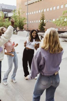 Happy female teenager friends dancing at skate park Sweden,Stockholm, model released Copyright: xMaskotx , MA85375
