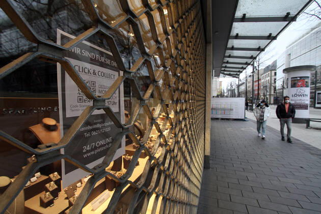Sticker with inscription Click Collect sticks to a closed jeweler in the city center of Mannheim, Baden Württemberg, Germany