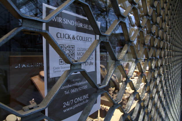 Sticker with inscription Click Collect sticks to a closed jeweler in the city center of Mannheim, Baden Württemberg, Germany