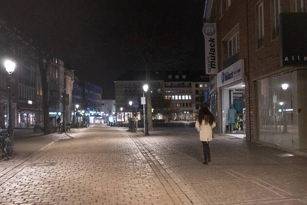 Like an abandoned city. Aachen on Easter vigil between 10 p.m. and 11 p.m. View of the deserted pedestrian zone Am Markt. In Aachen on April 3, 2021. A single woman walks through the pedestrian zone. GERMANY - AACHEN - EASTER Easter 2021 Covid Pandemic