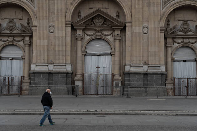 April 4, 2021, Santiago, Metropolitana, Chile: A man with a mask walks in front of the closed cathedral of Santiago, on Easter Sunday, in the middle of the total quarantine decreed last week for the Metropolitan Region. Santiago Chile - ZUMAb332 20210404_zip_b332_029 Copyright: xMatiasxBasualdox