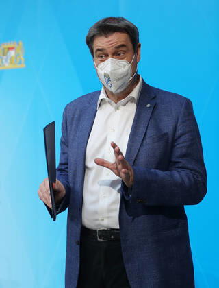 Press conference of Prime Minister Markus Söder Soeder Dr Markus Söder making small talk with some journalists after the official press conference, Munich Bavaria Germany Prinz Carl Palais