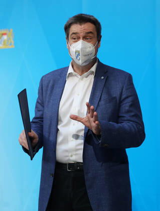 Press conference of Prime Minister Markus Söder Soeder Dr Markus Söder making small talk with some journalists after the official press conference, Munich Bavaria Germany Prinz Carl Palais