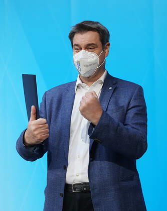 Press conference of Prime Minister Markus Söder Soeder Dr Markus Söder making small talk with some journalists after the official press conference, Munich Bavaria Germany Prinz Carl Palais
