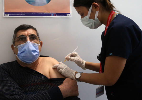 (210407) -- ANKARA, April 7, 2021 -- A man receives the COVID-19 vaccine in Ankara, Turkey, April 7, 2021. Turkey on Wednesday reported its largest single-day increase in infections with 54,740 new COVID-19 cases, according to its health ministry. (Photo by Xinhua) TURKEY-ANKARA-COVID-19 CASES-SURGE MustafaxKaya