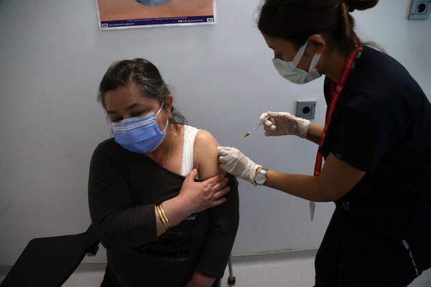 (210407) -- ANKARA, April 7, 2021 -- A woman receives the COVID-19 vaccine in Ankara, Turkey, April 7, 2021. Turkey on Wednesday reported its largest single-day increase in infections with 54,740 new COVID-19 cases, according to its health ministry. (Photo by Xinhua) TURKEY-ANKARA-COVID-19 CASES-SURGE MustafaxKaya