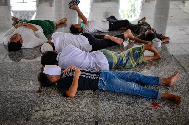 April 13, 2021, Palembang, South Sumatra, Indonesia: April 13, 2020, Palembang, South Sumatra, Indonesia : Muslims rest after praying during the holy month of Ramadan at the Great Mosque of Sultan Mahmud Badaruddin I Jayo Wikramo on April 13, 2021.Muslims around the world celebrate the holy month of Ramadan by praying during the night time and abstaining from eating, drinking, and sexual acts during the period between sunrise and sunset. Palembang Indonesia - ZUMAz115 20210413_zip_z115_004 Copyright: xALxZulkiflix