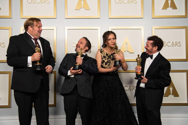 April 25, 2021, Los Angeles, California, USA: Phillip Bladh, Carlos CortÃ s, Michelle Couttolenc and Jaime Baksht pose backstage with the Oscar for Sound during the live ABC Telecast of The 93rd Oscars at Union Station in Los Angeles. Los Angeles USA  - ZUMAz03_ 20210425_sso_z03_192 Copyright: xMattxPetit AMPASx