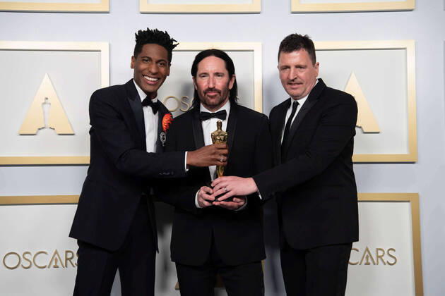 Jon Batiste, Trent Reznor, and Atticus Ross accept the Oscars for Original Score during the live ABC Telecast of The 93rd Oscars at Union Station in Los Angeles, CA on Sunday, April 25, 2021. Los Angeles CA USA  Copyright: xMattxPetitx 341351171THA