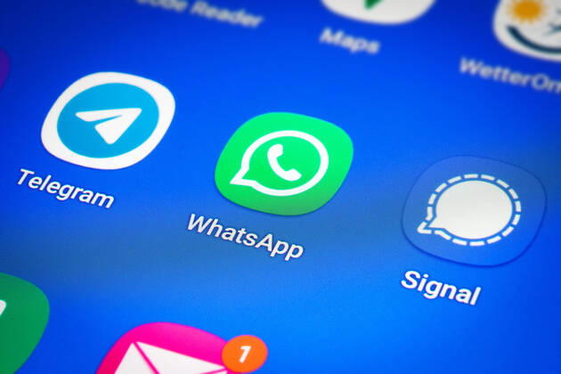 Logos of the social media messenger apps Telegram, WhatsApp and Signal on the screen of a smartphone