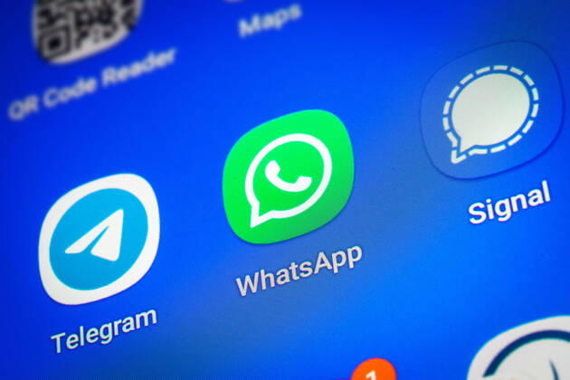 Logos of the social media messenger apps Telegram, WhatsApp and Signal on the screen of a smartphone